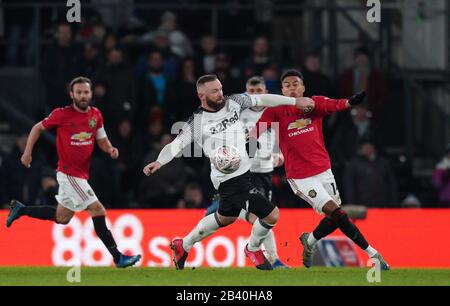 Derby, UK. 05th Mar, 2020. Wayne Rooney of Derby County and Jesse Lingard of Man Utd during the FA Cup 5th round match between Derby County and Manchester United at the Ipro Stadium, Derby, England on 5 March 2020. Photo by Andy Rowland. Credit: PRiME Media Images/Alamy Live News