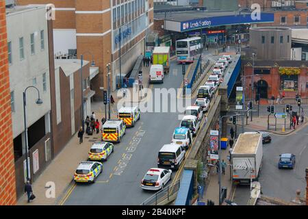 Leeds City Station entrance on New Station Street in Leeds. British Transport office is located to the left, while the taxi rank is opposite. Stock Photo