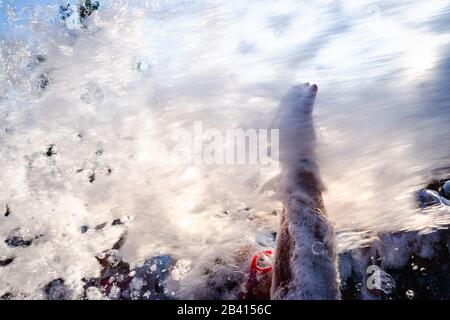 Kids having fun at a soap foam party. Stock Photo