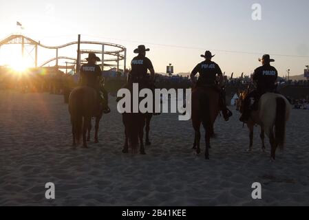 Mounted police on patrol during a concert on the Santa Monica beach. Stock Photo