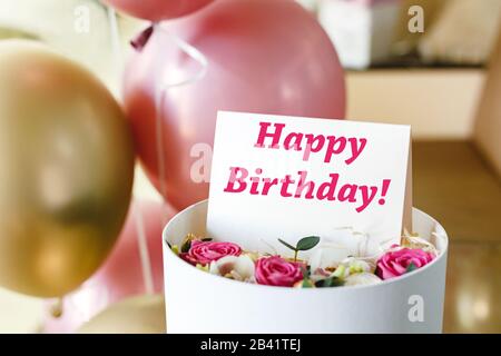 Premium Photo  Happy birthday text on card in flower bouquet on pink  background. flower delivery, congratulation card. greeting card in pink red  roses.