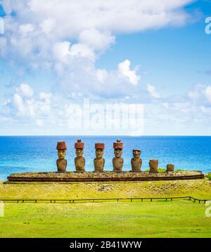 Panoranic view of moai statues on Ahu Nao-Nao platform on tropical Anakena Beach on the coast north of Easter Island (Rapa Nui), Chile Stock Photo