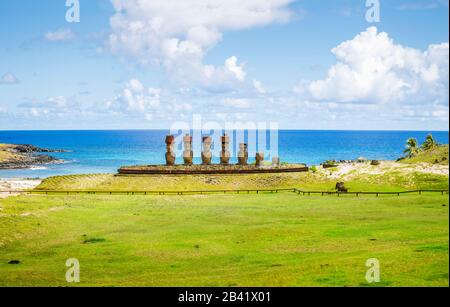 Panoranic view of moai statues on Ahu Nao-Nao platform on tropical Anakena Beach on the coast north of Easter Island (Rapa Nui), Chile Stock Photo