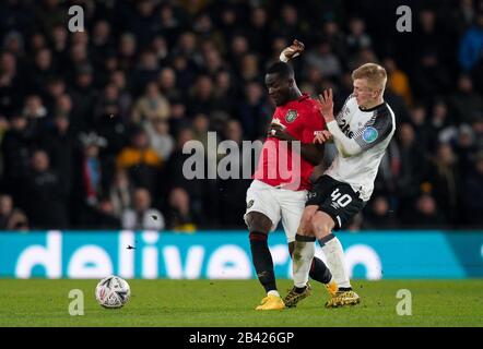 Derby, UK. 05th Mar, 2020. Eric Bailly of Man Utd obstructs Louie Sibley of Derby County during the FA Cup 5th round match between Derby County and Manchester United at the Ipro Stadium, Derby, England on 5 March 2020. Photo by Andy Rowland. Credit: PRiME Media Images/Alamy Live News