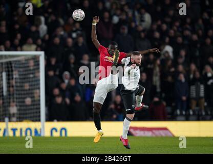 Derby, UK. 05th Mar, 2020. Eric Bailly of Man Utd & Wayne Rooney of Derby County during the FA Cup 5th round match between Derby County and Manchester United at the Ipro Stadium, Derby, England on 5 March 2020. Photo by Andy Rowland. Credit: PRiME Media Images/Alamy Live News