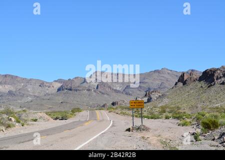 Do Not Enter When Flooded Sign on Route 66 in Mohave County, Arizona USA Stock Photo