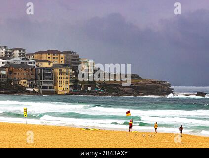 Life guard on duty during stormy weather at famous Bondi Beach in Sydney, Australia, during government restrictions on public outings during Covic 19 Stock Photo