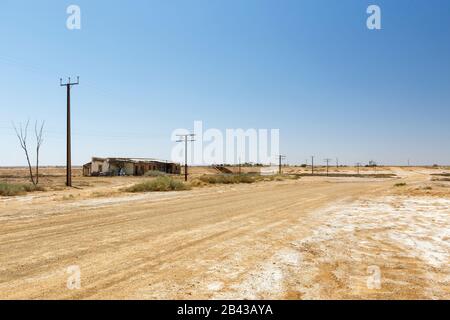 Australian Outback abandoned derelict house on the side of a dirt road in Marree, South Australia Stock Photo