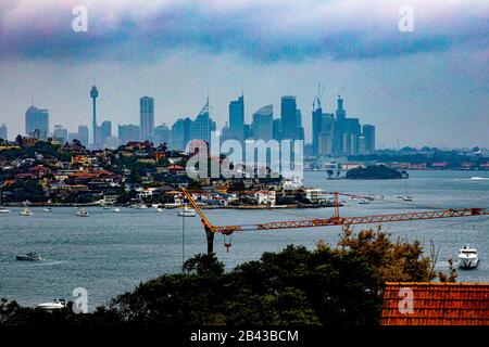 Dramatic harbour skyline seen from Vaucluse, with Shark Island, on a stormy afternoon in Sydney, capital of New South Wales in Australia Stock Photo