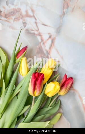 Beautiful tulips for Mother's Day on marble background, top view.International Women's Day.Bouquet of beautiful spring tulips. Fresh colorful tulip Stock Photo
