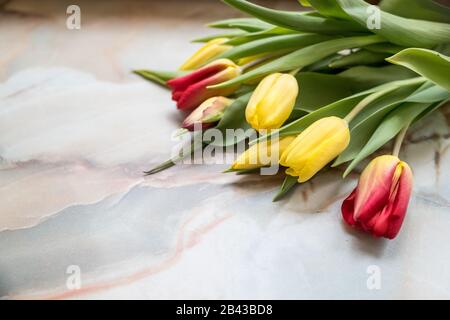 Beautiful tulips for Mother's Day on marble background, side view.International Women's Day.Bouquet of beautiful spring tulips. Fresh colorful tulip Stock Photo