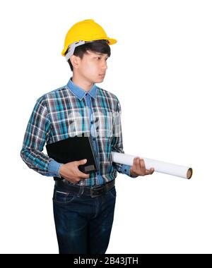 businessman young hold Laptop computer and rolled blueprints wear yellow safety helmet plastic on white background construction concept Stock Photo