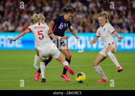 Orlando, Florida, USA. 5th Mar, 2020. United States forward CARLI LLOYD (10) competes for the ball against England defender STEPH HOUGHTON (5) during the SheBelieves Cup United States vs England match at Exploria Stadium in Orlando, Fl on March 5, 2020. Credit: Cory Knowlton/ZUMA Wire/Alamy Live News Stock Photo