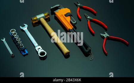 Set of mechanic tools on black background. Chrome wrenches or spanners, hexagon socket, end cutter pliers, locking pliers, pincers, plastic hammer Stock Photo