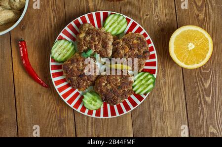 Shami kebab, variety of kebab, originating from the Indian subcontinent,  Awadhi cuisine, Traditional assorted Indian  dishes, Top view. Stock Photo