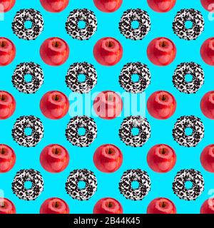 Seamless pattern chocolate donuts and red apples isolated on blue background, healthy vs junk food concept, cakes or fruits diet design, fresh fruit Stock Photo