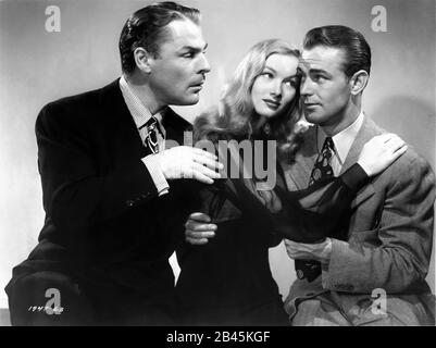 BRIAN DONLEVY VERONICA LAKE and ALAN LADD Posed Publicity Portrait for THE GLASS KEY 1942 director STUART HEISLER based on novel by DASHIELL HAMMETT costume designer EDITH HEAD Paramount Pictures Stock Photo