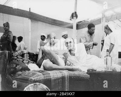 Mahatma Gandhi with secretary Mahadev Desai at the Congress Committee meeting, Bombay, Mumbai, Maharashtra, India, Asia, August 1942, old vintage 1900s picture Stock Photo