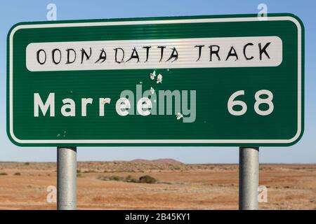 Marree Oodnadatta Track signage with bullet holes in the outback of Australia Stock Photo