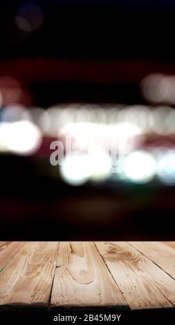 Wooden surface on black background of blurry spots. Mock up Stock Photo