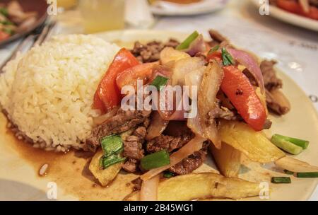 Lomo saltado, a famous traditional dish of South America, especially Peru, containing tomato, onions and beef