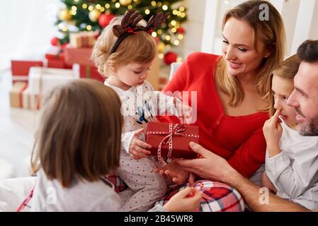 Happy baby with family in Christmas time Stock Photo
