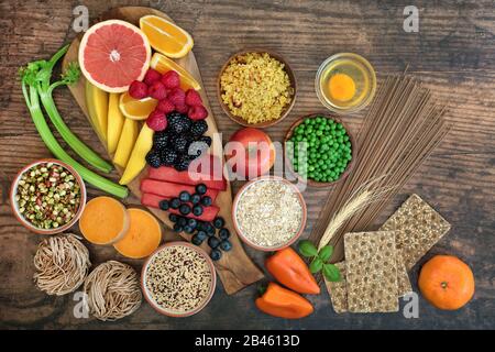 Health food for a healthy diet concept with foods high in antioxidants, anthocyanins, vitamins, minerals, protein, smart carbs, omega 3 and fiber. Stock Photo