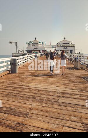 Malibu, California - February 17, 2020 : People walking on the Malibu Pier Stock Photo