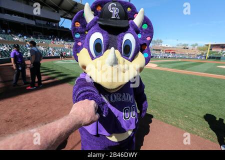 Dinger, the Colorado Rockies' mascot, interacts with fans at a