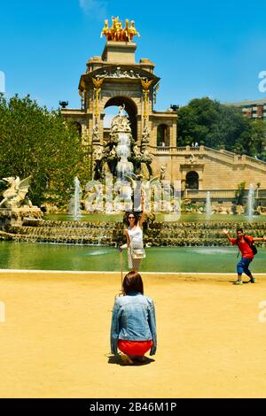 BARCELONA, SPAIN - MAY 30: Kid photobombing a photo to a tourist at the fountain of Parc de la Ciutadella on May 30, 2016 in Barcelona, Spain. This is Stock Photo