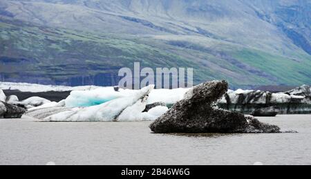 Panoramical view of Fjallsarlon glacial lagoon. Icebergs and mountains in Vatnajokull National Park, southeast Iceland, Europe. Landscape photography Stock Photo