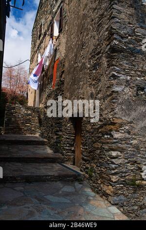 Narrow alley in old village on the isle of Corisca Stock Photo