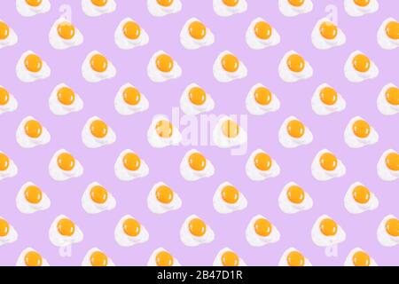Fried eggs pattern on pink background. View from above. Food fashion minimalistic concept. Stock Photo