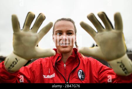 Freiburg, Germany. 17th Feb, 2020. Merle Frohms, goalkeeper of SC Freiburg, shows her goalkeeper gloves during training. Credit: Patrick Seeger/dpa - IMPORTANT NOTE: In accordance with the regulations of the DFL Deutsche Fußball Liga and the DFB Deutscher Fußball-Bund, it is prohibited to exploit or have exploited in the stadium and/or from the game taken photographs in the form of sequence images and/or video-like photo series./dpa/Alamy Live News Stock Photo