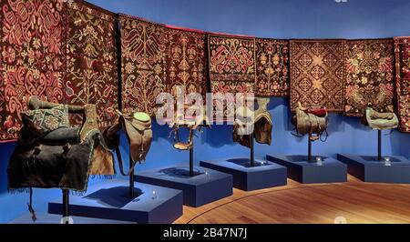 Reykjavik, The National Museum of Iceland, side-saddle with beautiful metal ornaments, covered with images often depicting exotic motifs of plants, animals and fantastic creatures. Also with 'hellüodull' a chair like saddle with a back-rest Stock Photo