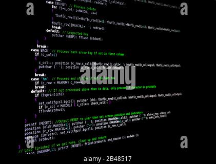 Source code for a computer program. View from an angle, text fades to a blur on the right. Language is C. Stock Photo
