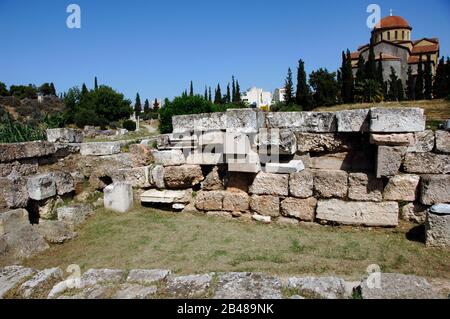 Greece, Athens. Area of Kerameikos (Ceramicus). Its name derives from 'potter's quarter'. Northwest of the Acropolis. Old cemetery. Ruins. Agia Triada Church at back. Stock Photo