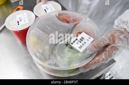 Wuhan, China's Hubei Province. 6th Mar, 2020. A staff member reserves meals as samples for later examination at a catering company in Wuhan, central China's Hubei Province, March 6, 2020. Credit: Cheng Min/Xinhua/Alamy Live News Stock Photo
