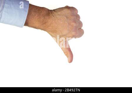 male hand with light blue business shirt with thumb down signin front of a  white background, copy space Stock Photo