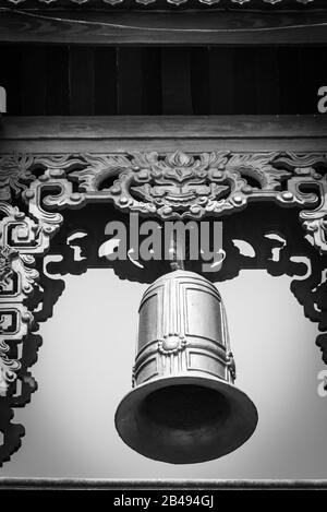 Filtered image typical bell tower outdoor instrument under clear blue sky in Vietnam Stock Photo