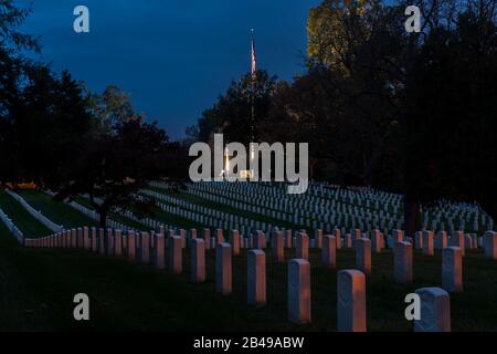 Headstones in rows at the Arlington, Virginia, National Cemetery at dusk Stock Photo