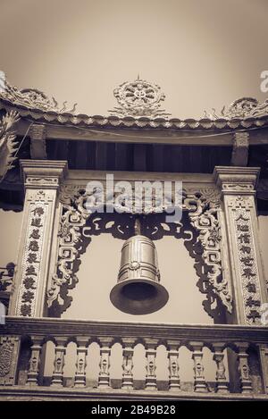 Filtered image typical bell tower outdoor instrument under clear blue sky in Vietnam Stock Photo