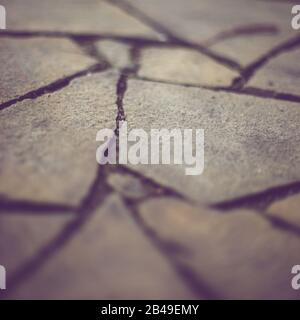 Brown wild stone pavement floor. Irregular shapes pattern. Stock Photo