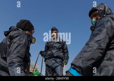 Tehran, Iran. 6th Mar, 2020. Firefighters and municipality workers with protective suits prepare to disinfect the streets, buses, and taxies as a precaution to the coronavirus (Covid-19) in Tajrish square of northern Tehran, Iran. Iranian officials canceled Friday prayer for the second week due to concerns over the spread of coronavirus and COVID-19. According to the last report by the Ministry of Health, there are 4,747 COVID-19 cases in Iran. 147 people have died so far. A Health Ministry spokesman warned authorities could use unspecified 'force' to halt travel between major cities. (Credi Stock Photo