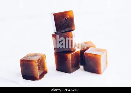 Ice cube tray with frozen coffee on grey table, closeup. Space for text  Stock Photo - Alamy