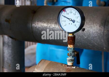 Pressure gauge showing pressure supply conduit. Stock Photo