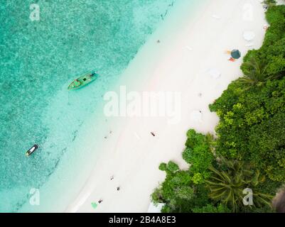 Aerial drone view of picture perfect beach and turquoise lagoon on small tropical island on Maldives Stock Photo
