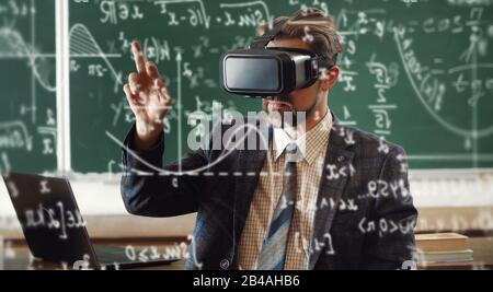 Teacher wearing virtual reality headset Stock Photo