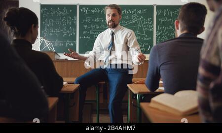 Students listening to teacher Stock Photo