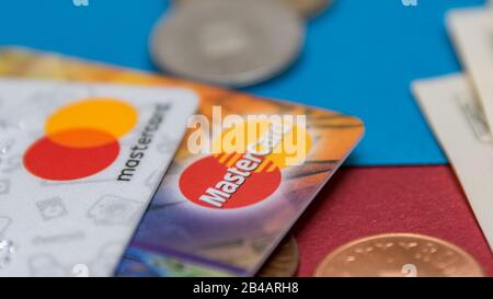 CLUJ, ROMANIA - NOV 08, 2019: MasterCard old and new logo macro, closeup on the plastic bank cards. Illustrative editorial, shallow depth of field of Stock Photo